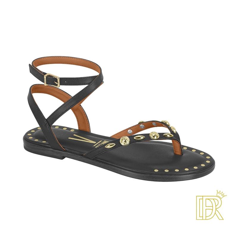 Sandals tied to the leg with golden details that give them an elegant touch