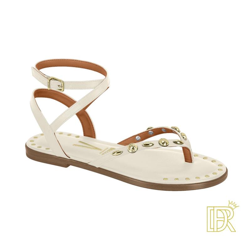 Sandals tied to the leg with golden details that give them an elegant touch